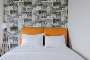 Contemporary Studio Room at Casa De Parco Apartment By Travelio